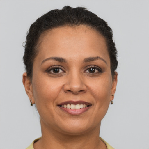 Joyful white young-adult female with short  brown hair and brown eyes