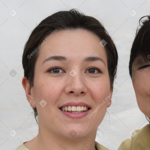 Joyful white young-adult female with medium  brown hair and brown eyes