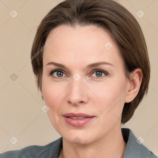 Joyful white adult female with medium  brown hair and grey eyes