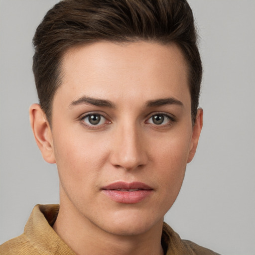 Joyful white young-adult female with short  brown hair and grey eyes