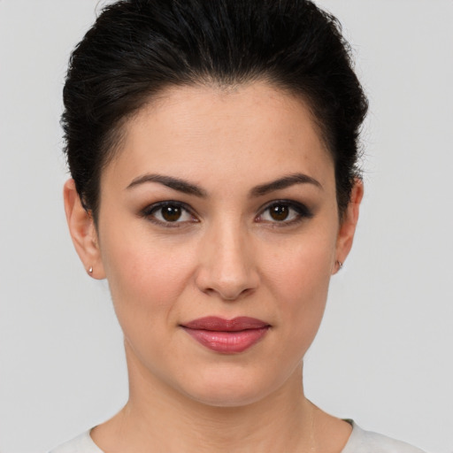 Joyful white young-adult female with short  brown hair and brown eyes