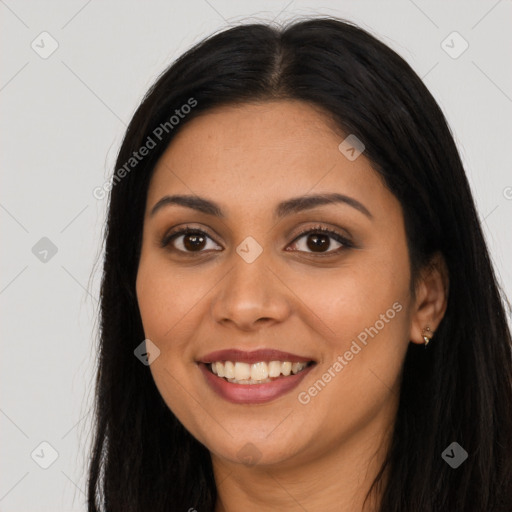 Joyful latino young-adult female with long  black hair and brown eyes