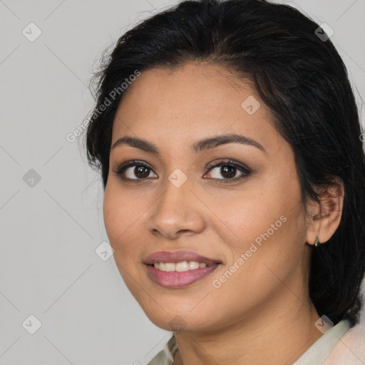 Joyful latino young-adult female with medium  brown hair and brown eyes