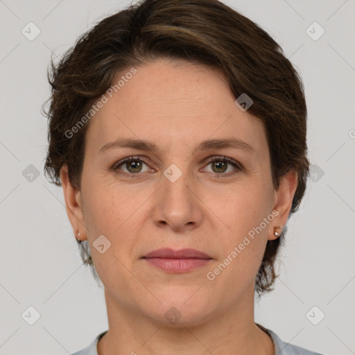 Joyful white adult female with short  brown hair and grey eyes