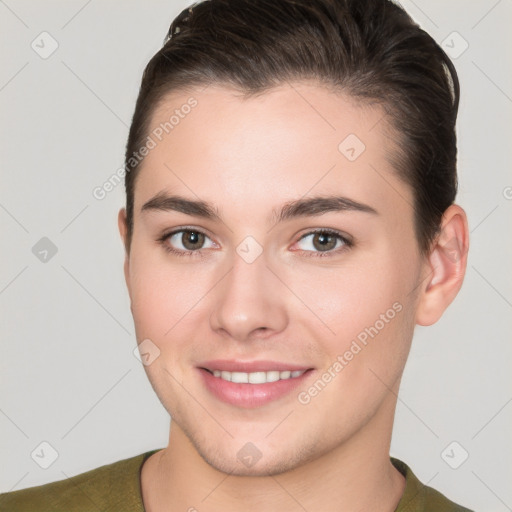 Joyful white young-adult female with short  brown hair and brown eyes