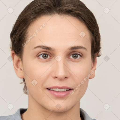 Joyful white young-adult female with short  brown hair and grey eyes