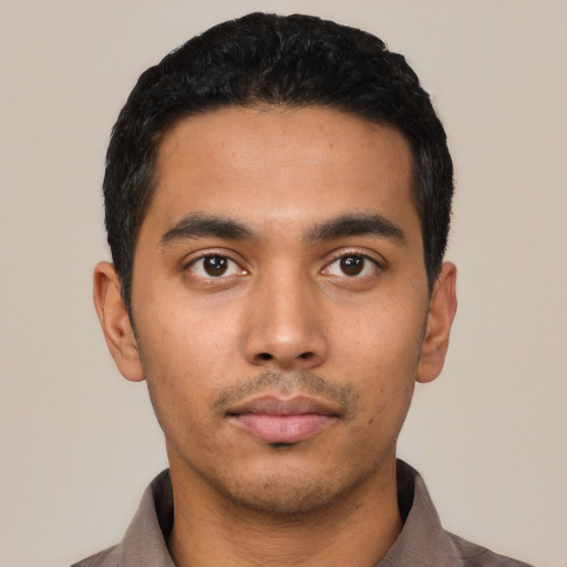 Neutral latino young-adult male with short  black hair and brown eyes