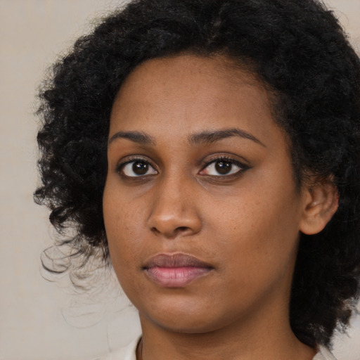 Neutral black young-adult female with long  black hair and brown eyes