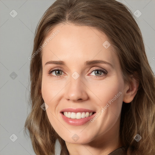 Joyful white young-adult female with long  brown hair and green eyes