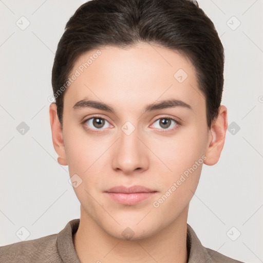 Neutral white young-adult male with short  brown hair and brown eyes