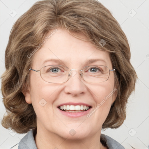 Joyful white adult female with medium  brown hair and blue eyes