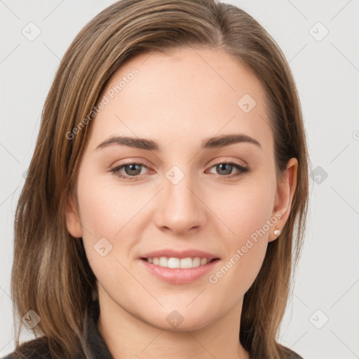 Joyful white young-adult female with long  brown hair and grey eyes