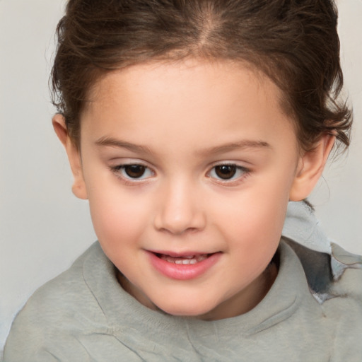 Joyful white child female with short  brown hair and brown eyes