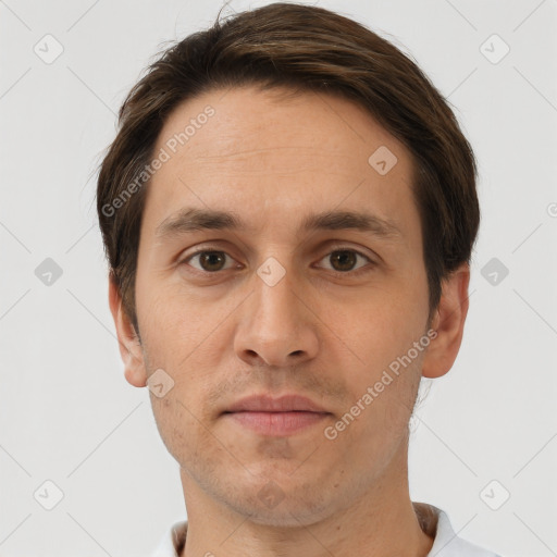 Joyful white adult male with short  brown hair and brown eyes