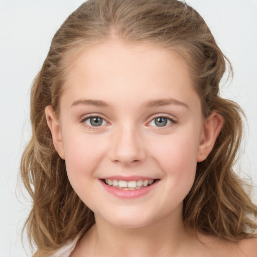 Joyful white child female with long  brown hair and grey eyes