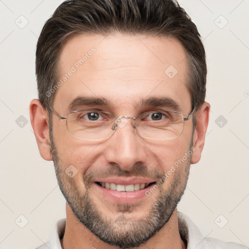 Joyful white adult male with short  brown hair and brown eyes