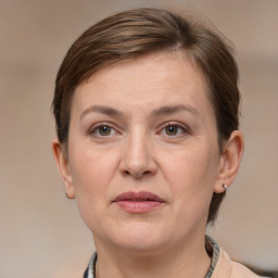 Joyful white adult female with short  brown hair and grey eyes