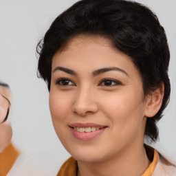 Joyful asian young-adult female with medium  brown hair and brown eyes