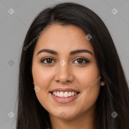 Joyful latino young-adult female with long  brown hair and brown eyes