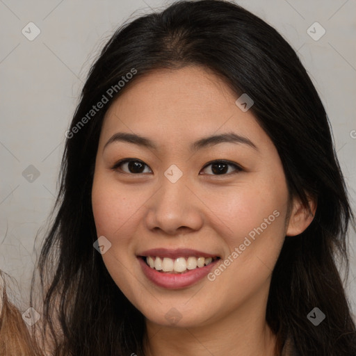 Joyful asian young-adult female with long  brown hair and brown eyes