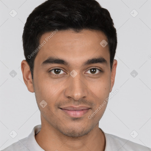 Joyful latino young-adult male with short  black hair and brown eyes