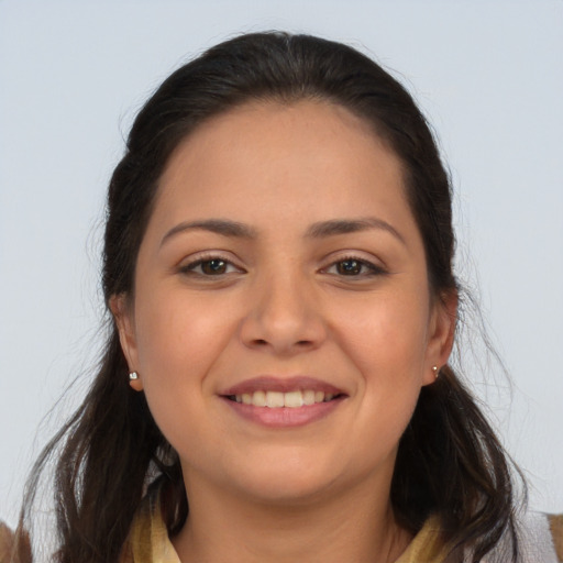 Joyful white young-adult female with long  brown hair and brown eyes