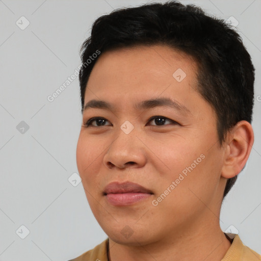 Joyful asian young-adult male with short  black hair and brown eyes