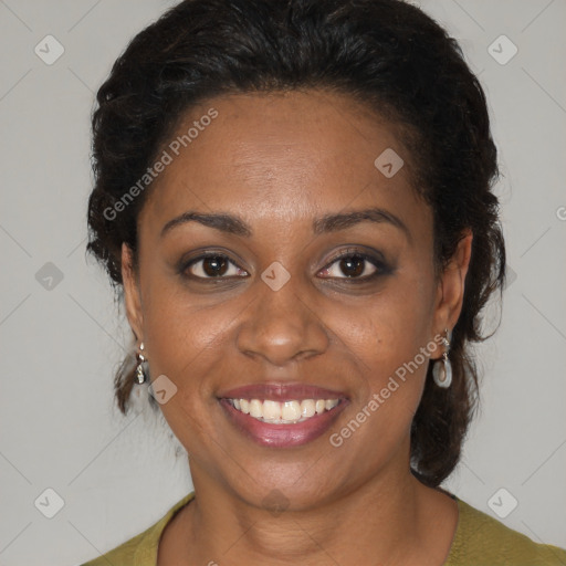 Joyful black adult female with medium  brown hair and brown eyes