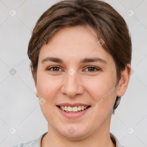 Joyful white young-adult female with short  brown hair and grey eyes