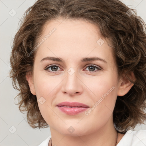 Joyful white young-adult female with medium  brown hair and green eyes