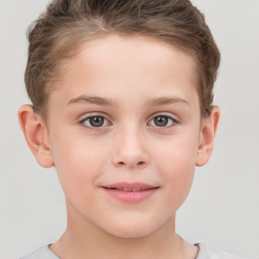 Joyful white child female with short  brown hair and grey eyes