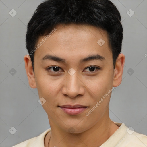 Joyful asian young-adult male with short  brown hair and brown eyes