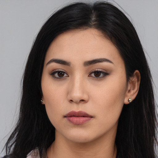 Neutral latino young-adult female with long  black hair and brown eyes