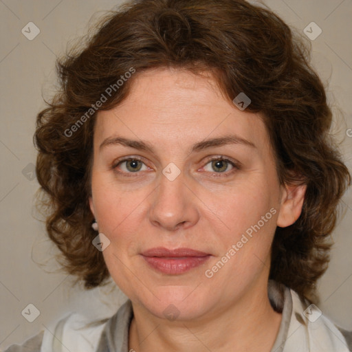 Joyful white adult female with medium  brown hair and blue eyes