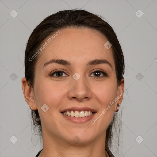 Joyful white young-adult female with medium  brown hair and grey eyes