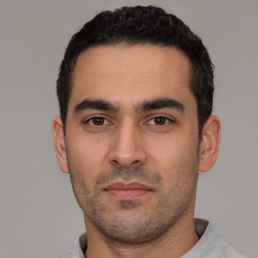 Neutral white young-adult male with short  black hair and brown eyes