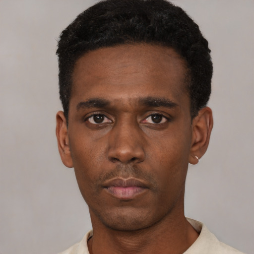 Neutral black young-adult male with short  black hair and brown eyes