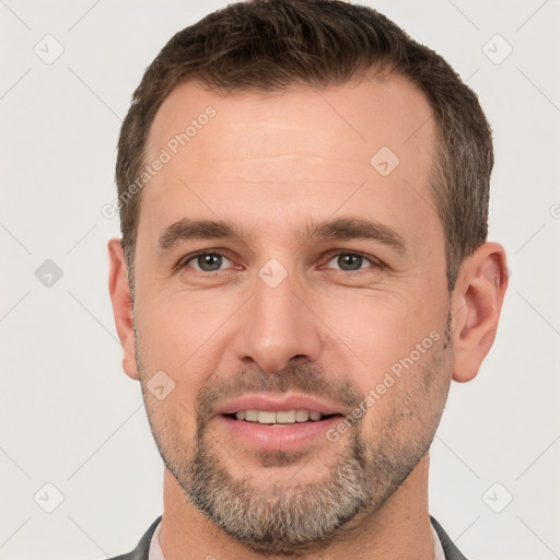 Joyful white adult male with short  brown hair and brown eyes