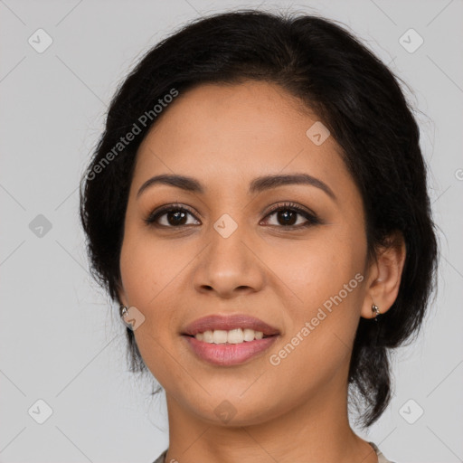 Joyful latino young-adult female with long  brown hair and brown eyes