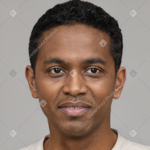 Joyful black young-adult male with short  black hair and brown eyes