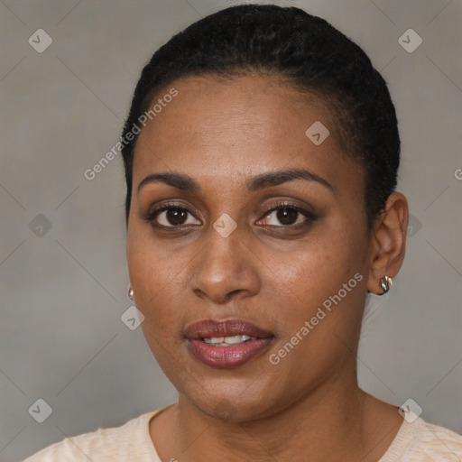 Joyful black young-adult female with short  black hair and brown eyes