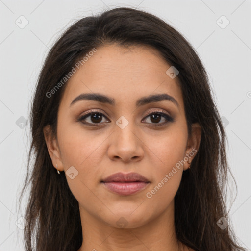 Joyful latino young-adult female with long  brown hair and brown eyes