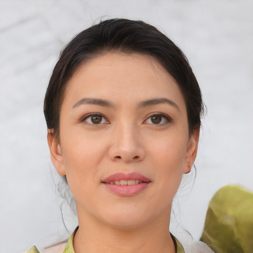 Joyful asian young-adult female with medium  brown hair and brown eyes