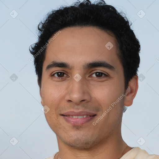 Joyful latino young-adult male with short  brown hair and brown eyes