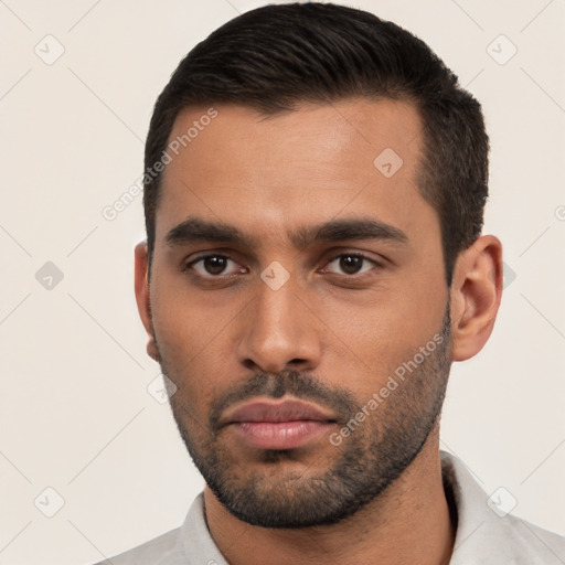 Neutral latino young-adult male with short  black hair and brown eyes