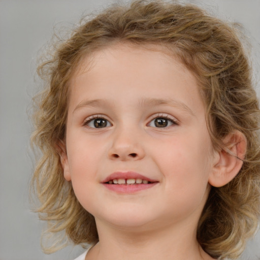 Joyful white child female with medium  brown hair and brown eyes