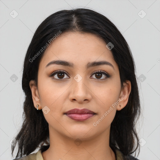 Joyful latino young-adult female with medium  brown hair and brown eyes