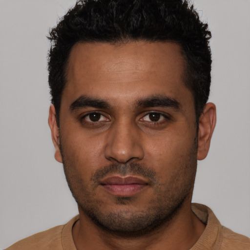 Neutral latino young-adult male with short  black hair and brown eyes