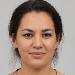 Joyful asian young-adult female with medium  brown hair and brown eyes