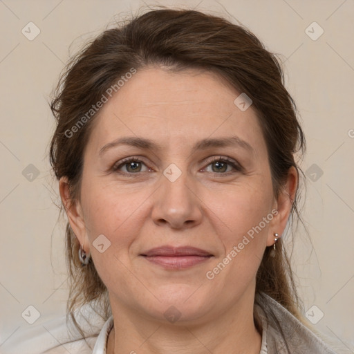 Joyful white adult female with medium  brown hair and brown eyes